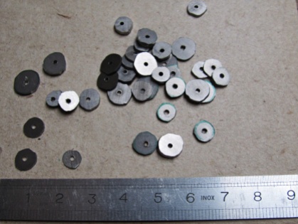 The discs are quite small, with a diameter of around 6-9 mm. Here they are just cut and still need to get the rough edges taken off.